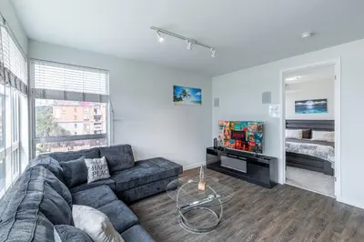 a living room with a couch and a tv at 2 Bed 2 Bath X street LA Live, Convention Center, Microsoft Theater in Los Angeles
