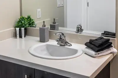 a bathroom counter with a sink and a mirror at 2 Bed 2 Bath X street LA Live, Convention Center, Microsoft Theater in Los Angeles