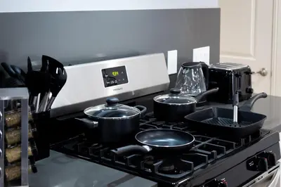 a kitchen with pots and pans on a stove at Luxury Oasis in Culver City! Free parking and Jacuzzi in Los Angeles