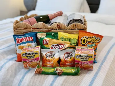 a basket of chips and snacks on a bed at Cozy 2B1B Apt Prime Location Newly Remodeled in Alhambra