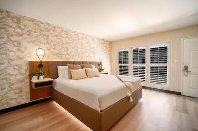a bedroom with a large bed and a window at LYFE INN & SUITES by AGA - Beverly Hills in Los Angeles