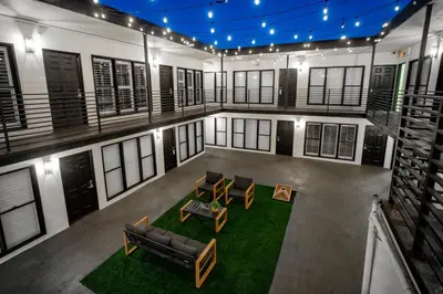 an overhead view of a living room with couches and chairs at LYFE INN & SUITES by AGA - Beverly Hills in Los Angeles