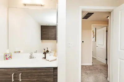 a bathroom with a sink and a mirror at Luxury One Bedroom minutes from The Grove in Los Angeles