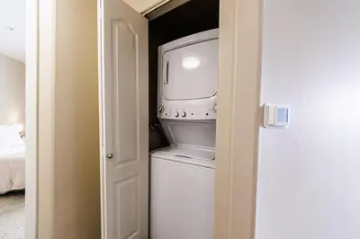 a washer and dryer in a small room at Spacious 3-Bedroom 3BTH Apt in Marina Del Rey! Pool, Hot Tub in Los Angeles