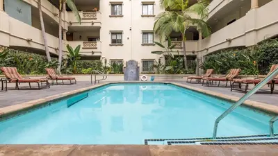 a swimming pool in front of a building at LALA House -1Br with Free Parking, Pool, Laundry in Los Angeles