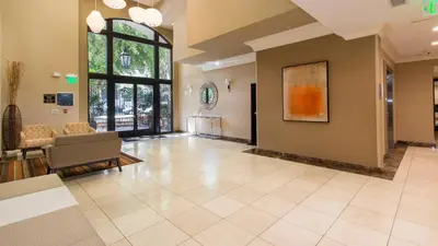 a living room with a couch and a chair at LALA House -1Br with Free Parking, Pool, Laundry in Los Angeles