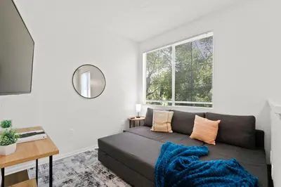 a living room with a couch and a window at 4bd Townhouse - Special Limited Time Offer near Venice Beach! in Los Angeles