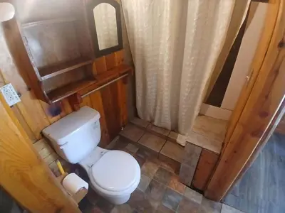an overhead view of a bathroom with a toilet at Big Bear Lake - Tulip Lane Cabin #23 - Micro Cabin in Big Bear Lake