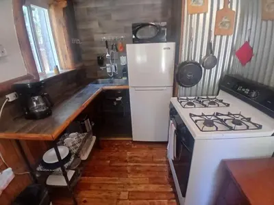 a kitchen with a white stove and a white refrigerator at Big Bear Lake - Tulip Lane Cabin #25 in Big Bear Lake