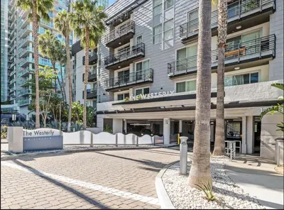 a courtyard in front of a building with palm trees at Cozy Oasis in Marina Del Rey!Free Swimming Pool and Parking in Los Angeles