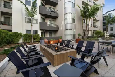 a patio with chairs and a fire pit in front of a building at Cozy Oasis in Marina Del Rey!Free Swimming Pool and Parking in Los Angeles