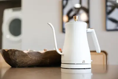 a tea kettle sitting on a table next to a wooden spoon at Lovely 1 BD in West Hollywood in Los Angeles