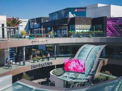 a building with a laptop on a table in front of it at Splendid 2BR, 2BA Apt 12 Min Walk to SM Pier! in Los Angeles