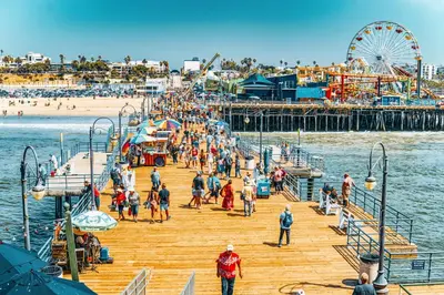 a group of people on a pier at a beach at Splendid 2BR, 2BA Apt 12 Min Walk to SM Pier! in Los Angeles