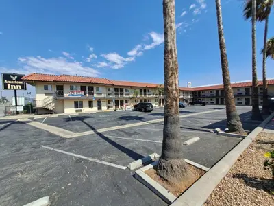 a parking lot in front of a hotel at American Inn i10 Rialto and Colton in Rialto