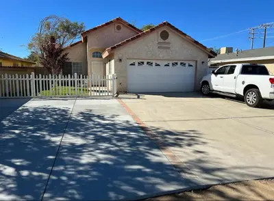 a white truck parked in front of a house at Cheerful 3BR 2BA Sauna Spa Pool Table PPong BBQ More in Lancaster