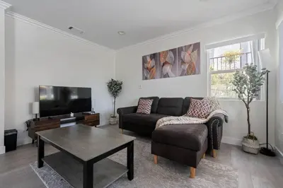 a living room with a couch and a coffee table at Serene Home in Central Burbank in Burbank