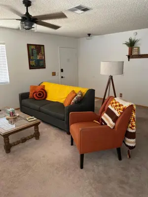 a living room with a couch and a chair at Quaint Vintage Ranch Style 4BedRoom 2Bath Sleeps 10 in Lancaster