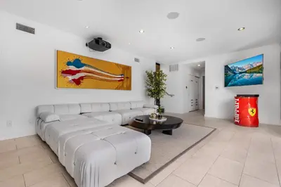 a living room with a white couch and a table at Maravilla in Los Angeles