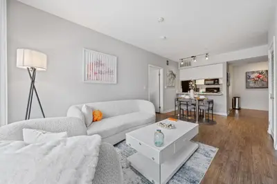 a living room with a couch and a table at Le Reve , 5 min to the beach Luxury Condo in Los Angeles