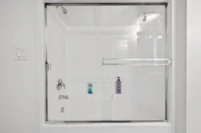 a shower with a glass door in a bathroom at Le Reve , 5 min to the beach Luxury Condo in Los Angeles