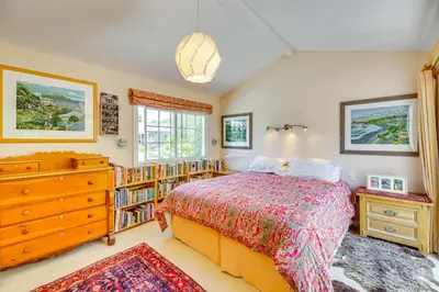 a bedroom with a bed and a book shelf at Vibrant Home with Patio - Near Santa Monica Pier! in Los Angeles