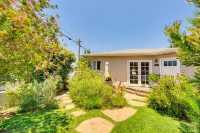 a home with a garden with grass and trees at Vibrant Home with Patio - Near Santa Monica Pier! in Los Angeles