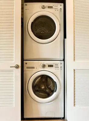 a washing machine and a dryer in a room at Bright lights central Downtown in Los Angeles