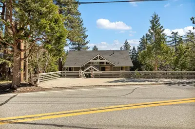 a house sitting on the side of a road at Pine Oaks Cabin in Lake Arrowhead