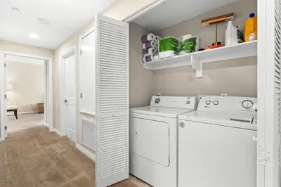 a white laundry room with a washer and dryer at Charming 2BR2BA Home Near Downtown LA And Walkable Amenities in Monterey Park