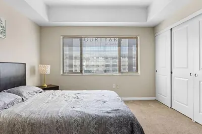 a bedroom with a large bed and a window at Charming 2BR2BA Home Near Downtown LA And Walkable Amenities in Monterey Park