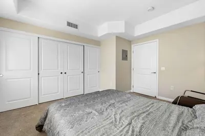 a bedroom with white cabinets and a large bed at Charming 2BR2BA Home Near Downtown LA And Walkable Amenities in Monterey Park