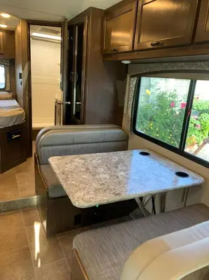an interior view of a kitchen and living room in an rv at AJ-XL RV Rental in Reseda