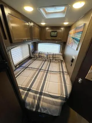 a large bed in the back of an rv at AJ-XL RV Rental in Reseda
