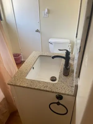 a bathroom with a sink and a toilet at UCLA Thurston in Los Angeles