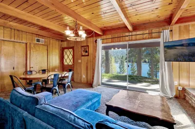 a living room with a blue couch and a table at Inspiration point retreat #2470 in Big Bear Lake