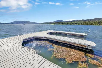 a dock in the middle of a body of water at Eagle point lake house #2471 in Big Bear Lake
