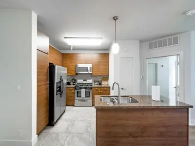 a kitchen with a stainless steel refrigerator and a sink at Stylish 1bd in Marina Del Rey with Free Parking in Los Angeles