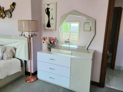 a bedroom with a dresser with a mirror on it at Luxury Hill Villa with Spectacular View in Anaheim