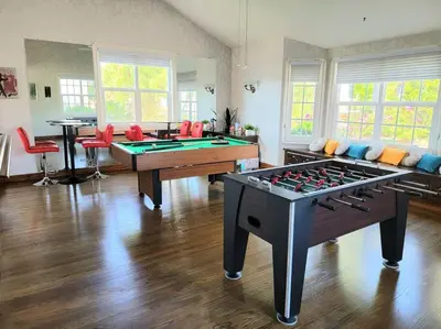a large living room with a pool table and chairs at Luxury Hill Villa with Spectacular View in Anaheim