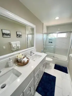 a bathroom with a sink and a shower and a toilet at Top of the World Anaheim View Home in Anaheim