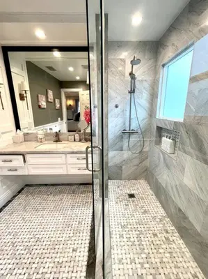 a bathroom with a shower and a sink at Ocean Boulevard Beachfront Home in Long Beach