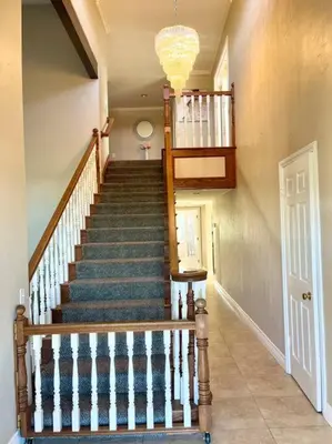 a staircase in a home with a stair case at Majestic Anaheim Panorama Hill Home With Sunset in Anaheim