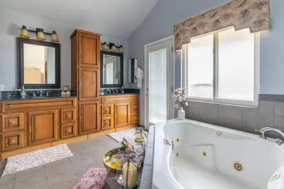 a large bathroom with a tub and a sink at Majestic Anaheim Panorama Hill Home With Sunset in Anaheim
