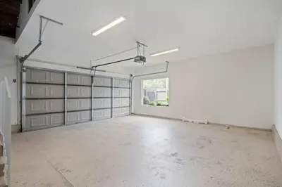 an empty garage with white walls and a window at Elm Mountain View Fire pit, quiet and more in Los Angeles