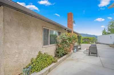 a building with a window and some plants next to it at Elm Mountain View Fire pit, quiet and more in Los Angeles