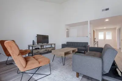 a living room with a couch and chairs and a tv at Elm Mountain View Fire pit, quiet and more in Los Angeles