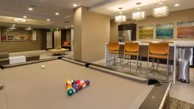 a billiard room with a pool table and a bar at Holiday in LA - 1br with Free parking, Laundry, Pool in Los Angeles