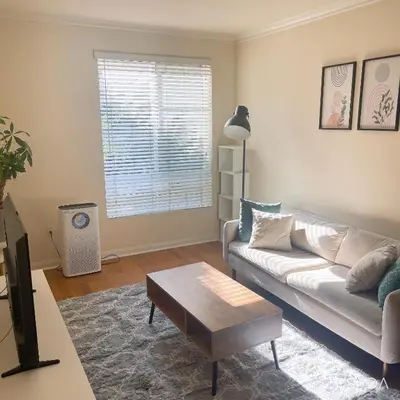 a living room with a couch and a coffee table at Holiday in LA - 1br with Free parking, Laundry, Pool in Los Angeles