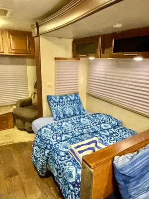 a bedroom with a bed and a couch at Rooms in Modern RV Trailer Home in Los Angeles
